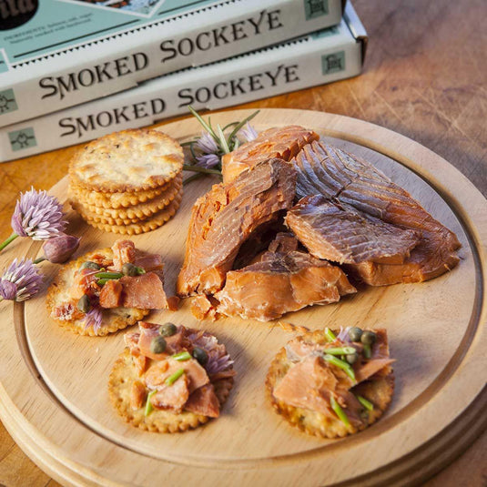 Plated smoked sockeye salmon fillets with crackers
