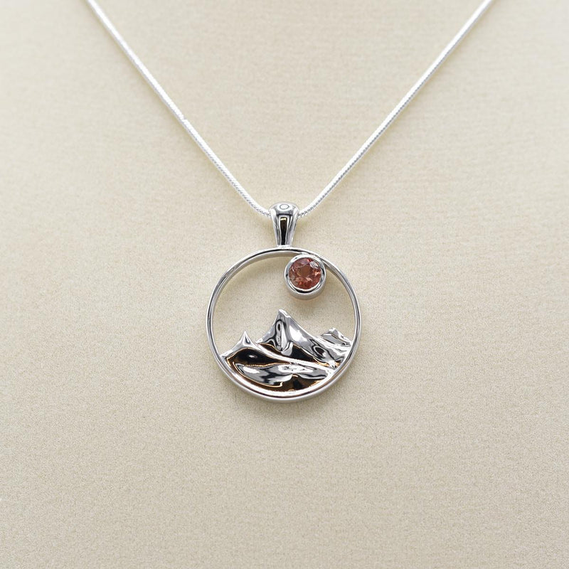 Load image into Gallery viewer, Desert Sun Gems Mountain Charm Sunstone Necklace on jewelry form
