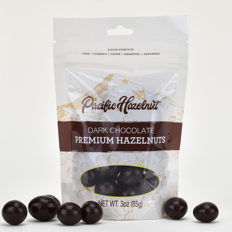 Load image into Gallery viewer, Pacific Hazelnut Farms Dark Chocolate Premium Hazelnuts 3oz Bag
