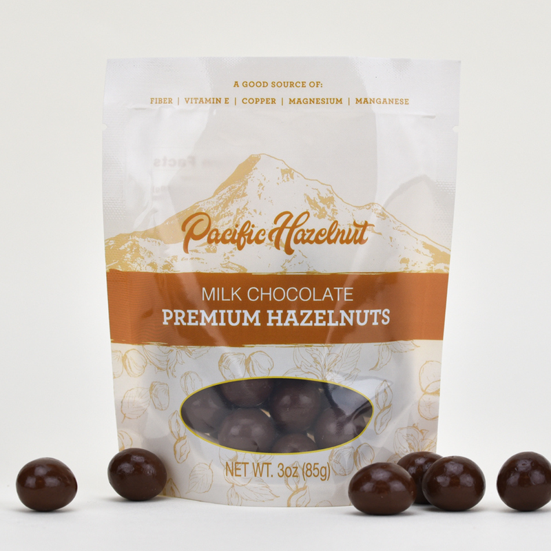 Load image into Gallery viewer, Pacific Hazelnut Farms Milk Chocolate Covered Hazelnuts 3oz Bag
