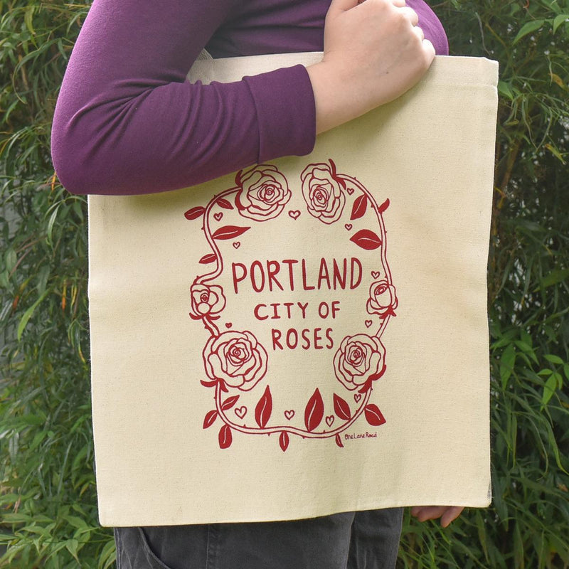 Load image into Gallery viewer, One Lane Road Portland City of Roses Canvas Tote Bag on model
