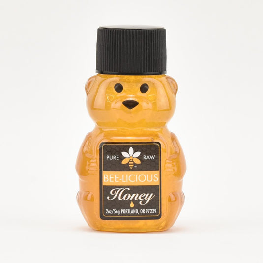 pure raw bee licious honey 2 oz front of bear