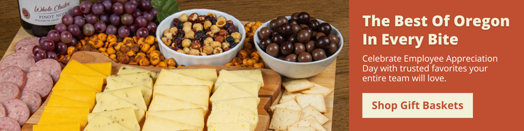 The Best of Oregon In Every Bite, Shop Gift Baskets. Image with assorted cheeses, summer sausage, and nuts.