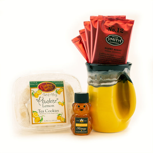 Made In Oregon Tea Lovers Gift Basket. Includes honey, tea, lemon cookies, and yellow Clay in Motion ceramic handwarmer mug.
