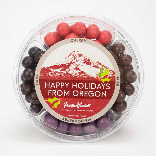 Pacific Hazelnut Farms Hazelnut Holiday Round, featuring four flavors of chocolate covered hazelnuts.