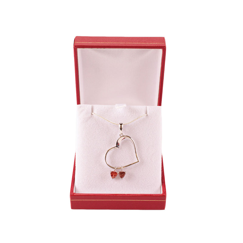 Load image into Gallery viewer, Desert Sun Gems necklace with sterling silver heart charm and two dangling 5mm sunstone gems, in box
