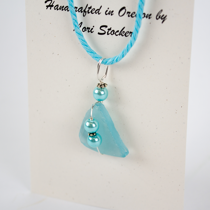 Load image into Gallery viewer, Essence of Fire &amp; Sea Blue Beach Glass Necklace pendant
